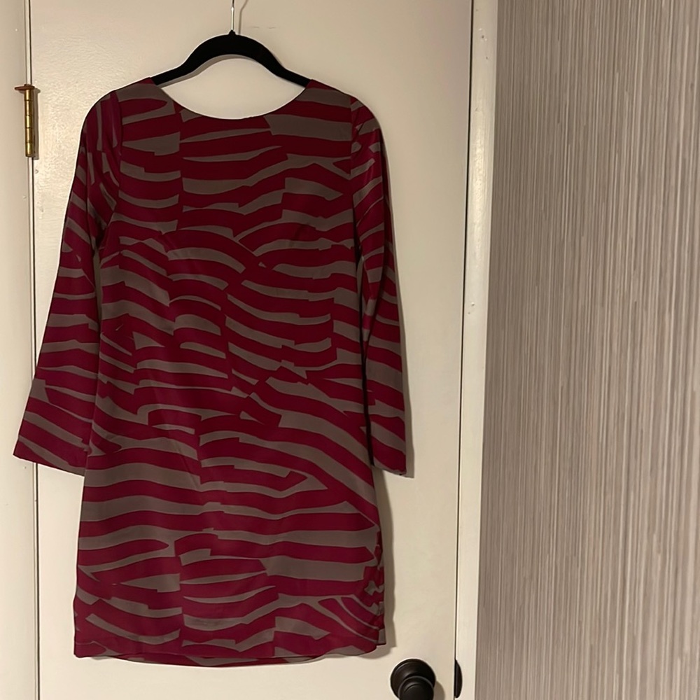 Plum and grey colored worn once size xs. Polyester